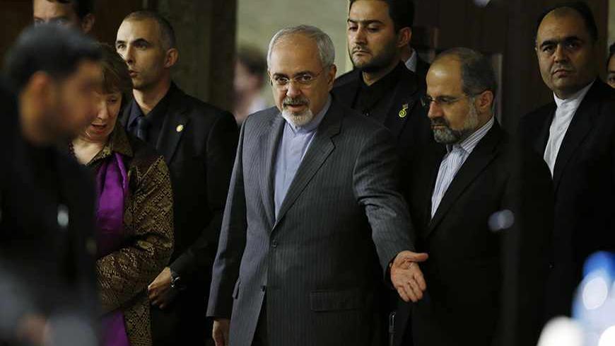 European Union foreign policy chief Catherine Ashton (obscured) and Iranian Foreign Minister Mohammad Javad Zarif (4th R) arrive at a news conference at the end of the Iranian nuclear talks in Geneva November 10, 2013. Zarif and Ashton said on Sunday they hoped Iran and six world powers would reach an agreement when they gather again in 10 days, adding that the latest round of talks on Tehran's nuclear programme was something all delegations can build on.  REUTERS/Jason Reed   (SWITZERLAND - Tags: POLITICS)