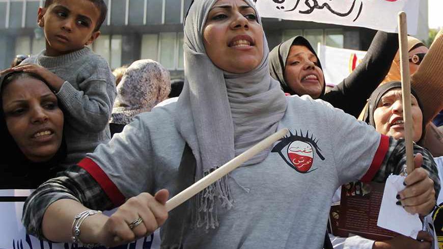 Women shout slogans against the government and members of the Muslim Brotherhood and Salafists during a protest against the absence of a women parliamentary quota in the constitution and to demand more women rights in front of the Shura Council in Cairo November 13, 2013. According to a Thomson Reuters Foundation poll on 22 Arab states, Egypt emerged as the worst country to be a woman in the Arab world today, followed closely by Iraq and Saudi Arabia. Egypt scored badly in almost every category, including g