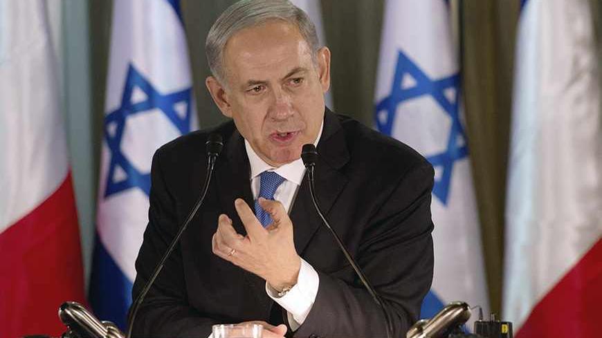 Israel Prime Minister Benjamin Netanyahu speaks during a joint news conference with French President Francois Hollande (not pictured) at his residence in Jerusalem November 17, 2013. President Hollande assured Israel on Sunday that France would continue to oppose an easing of economic sanctions against Iran until it was convinced Tehran had ended a pursuit of nuclear weapons. REUTERS/Alain Jocard/Pool (JERUSALEM - Tags: POLITICS) - RTX15HKF