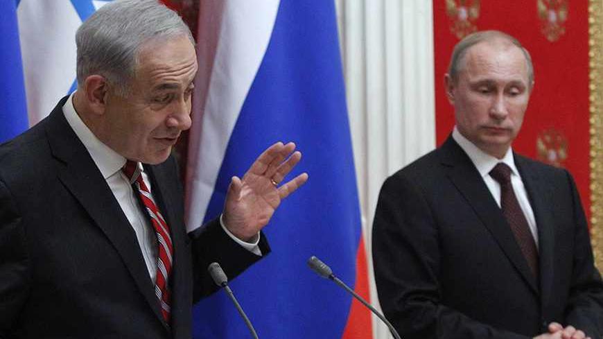 Russian President Vladimir Putin (R) and Israel's Prime Minister Benjamin Netanyahu take part in a joint news conference in Moscow's Kremlin November 20, 2013.  Putin said after talks that both sides hoped a "mutually acceptable resolution" could soon be found over Iran's nuclear ambitions. REUTERS/Maxim Shemetov (RUSSIA - Tags: POLITICS) - RTX15M33