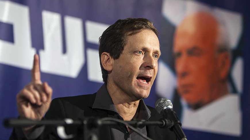 Issac Herzog, the new leader of Israel's Labour party, speaks during a news conference in Tel Aviv November 22, 2013. Israel's struggling opposition Labour party has elected Herzog seen as a potential moderate ally for Prime Minister Benjamin Netanyahu's rightist cabinet, results of a party poll showed on Friday. REUTERS/Nir Elias (ISRAEL - Tags: POLITICS) - RTX15OGA
