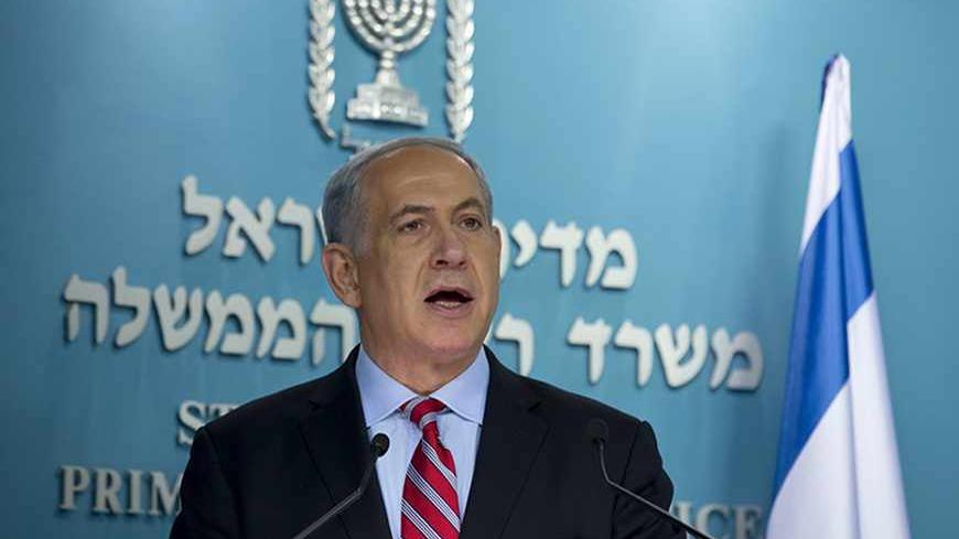 Israel's Prime Minister Benjamin Netanyahu delivers a statement at his office in Jerusalem November 24, 2013. Netanyahu on Sunday denounced the world powers' nuclear agreement with Iran as a historic mistake that left the production of atomic weapons within Tehran's reach. REUTERS/Baz Ratner (JERUSALEM - Tags: POLITICS) - RTX15R07