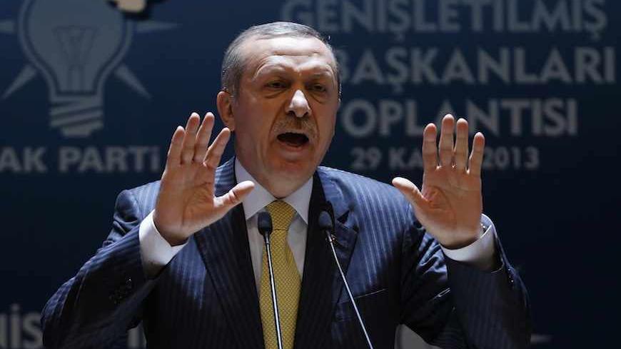 Turkey's Prime Minister Tayyip Erdogan addresses members of his ruling AK Party (AKP) during a meeting in Ankara November 29, 2013. Turkey and Iraqi Kurdistan signed a multi-billion-dollar energy package this week that will help transform the semi-autonomous region into an oil and gas powerhouse but infuriate a central Baghdad government wary of increasing Kurdish autonomy. The energy deal came in the early hours of a frosty Wednesday morning in Ankara, and was signed during a three-hour meeting between Kur