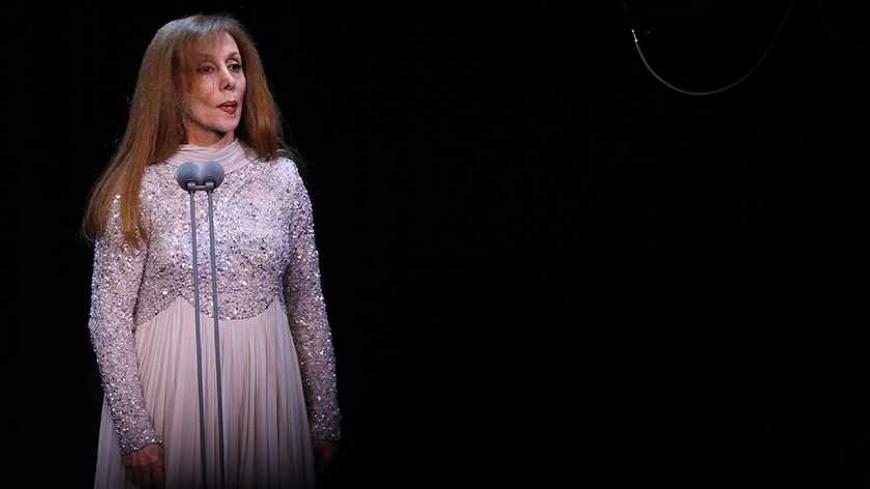 Lebanese diva Fairuz performs at Lebanon's new state-of-art Platea theatre in Sahel Alma north of the capital Beirut on December 9, 2011. The 77-year-old singer began her career in the early 1950s and became an icon across the Arab  world with hundreds of songs mainly written by the Rahbani Brothers and later her son Ziad Rahbani. AFP PHOTO/ANWAR AMRO (Photo credit should read ANWAR AMRO/AFP/Getty Images)