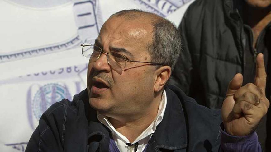 Knesset (parliament) member Israeli Arab Ahmad Tibi campaigns seeking reelection ahead of Israel's general elections in the Israeli Arab town of Umm al-Fahm on January 14, 2013.  Arab-Israelis, descendants of the 160,000 Palestinians who stayed on after the creation of Israel in 1948, make up 20 percent of the population. AFP PHOTO/AHMAD GHARABLI        (Photo credit should read AHMAD GHARABLI/AFP/Getty Images)