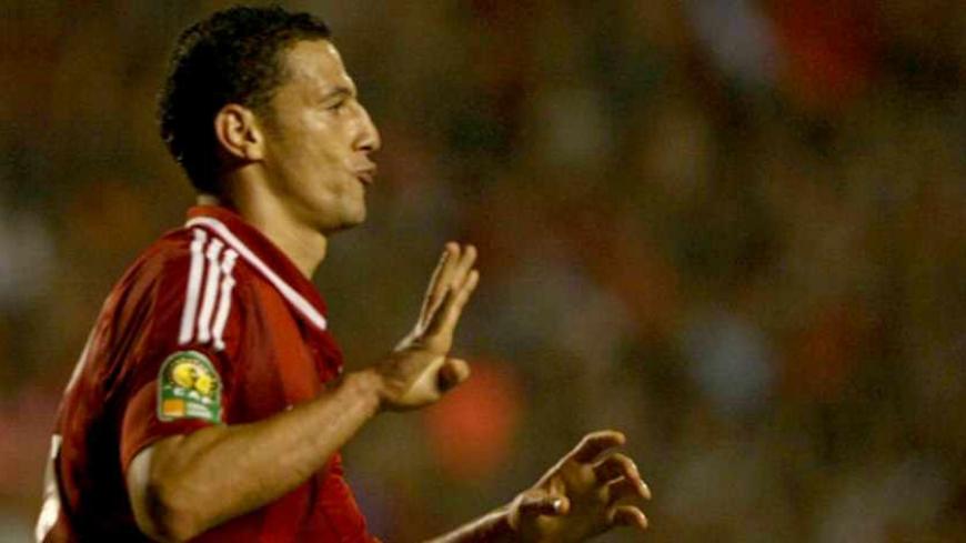 CAIRO, EGYPT - NOVEMBER 10:  Ahmed Abdelzaher of Al Ahly flashes Rabia sign as celebrates his goal during the CAF Champions League second leg final match between South Africa's Orlando Pirates and Egyptian team Al-Ahly at the Arab Contractors stadium on November 10, 2013 in Cairo, Egypt. (Photo by Ahmed Ismail/Anadolu Agency/Getty Images)