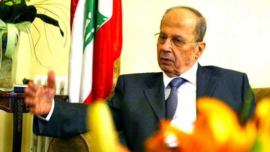 Lebanon's anti-Syrian Christian Leader Michel Aoun speaks during an interview with Reuters in his house near Beirut.  Lebanon's anti-Syrian Christian Leader Michel Aoun speaks during an interview with Reuters in his house near Beirut May 11,2005. Former general Michel Aoun, a leading opponent of Syria influence, said on Wednesday he was willing to join forces with allies of Damascus,including Hizbollah, to contest elections starting this month. REUTERS/Jamal Saidi - RTRAU5B