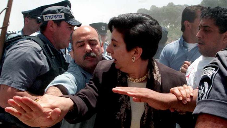 Prominent Palestinian human rights advocate hanan Ashrawi is protected by a Palestinians who tries to keep Israeli riot police from pushing her during scuffles which broke out May 27 at the Ras Al-Amud settlement complex under construction in Arab East Jerusalem. Israeli police say they had to use force to prevent the Palestinian demonstrators from pushing their way into the construction site during a demonstration against the continuing building restarted after months of suspension.
JWH/GB - RTRPJGB