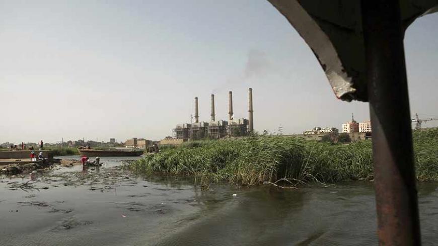 Women wash clothes in the river Nile in Cairo May 20, 2013. Most of Egypt's population live clustered around the Nile valley and delta, and the river is both a vital resource for the country's citizens, and a potent national symbol. In a recent dispute with Ethiopia over the construction of a dam upstream, Egypt's foreign minister Mohamed Kamel Amr underlined the country's reliance on the river's waters: "No Nile - no Egypt," he said. Picture taken May 20, 2013. REUTERS/Asmaa Waguih (EGYPT - Tags: POLITICS 