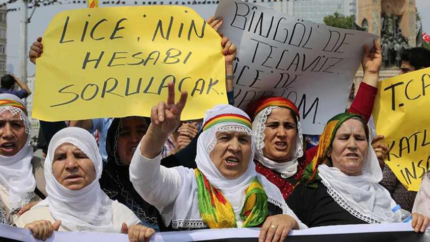 Protesters shout slogans during a demonstration against Turkish security forces, after an incident in the Lice district of Diyarbakir province killed one person and wounded seven on Friday, in Istanbul June 29, 2013. Turkish security forces killed one person and wounded seven on Friday when they fired on a group of people protesting against construction of a new gendarmerie outpost in Kurdish-dominated southeastern Turkey, security sources said. The incident happened in the village of Kayacik in the Lice di