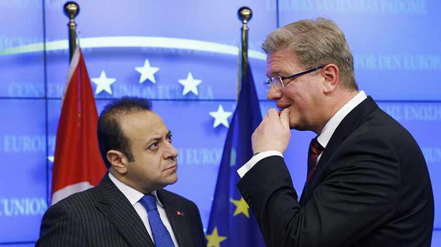 Turkey's European Affairs Minister Egemen Bagis listens to European Enlargement Commissioner Stefan Fule (R) after EU-Turkey accession talks in Brussels November 5, 2013.    REUTERS/Francois Lenoir (BELGIUM - Tags: POLITICS) - RTX150NH