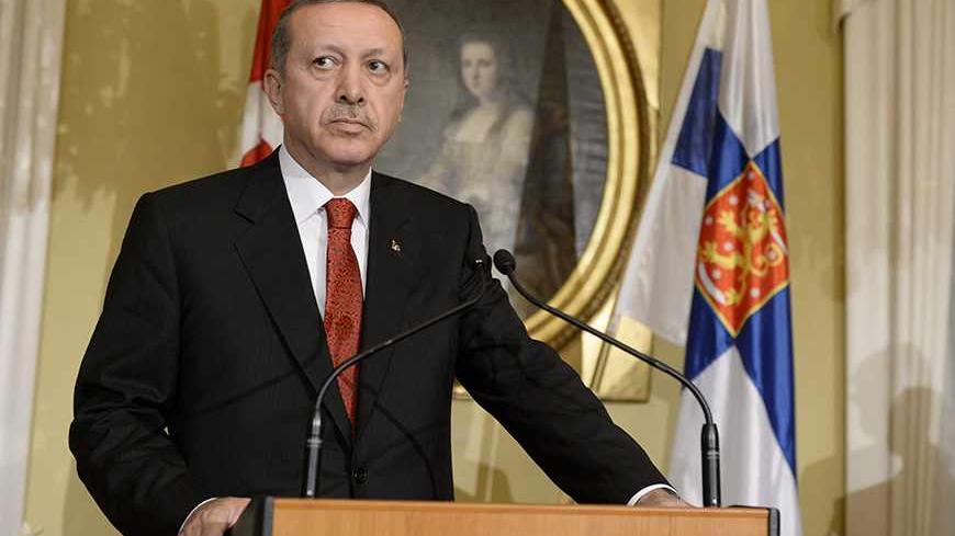 Turkey's Prime Minister Tayyip Erdogan addresses reporters during a news conference at the Government Banquet Hall in Helsinki, November 6, 2013. REUTERS/Jussi Nukari/Lehtikuva (FINLAND - Tags: POLITICS) ATTENTION EDITORS - THIS IMAGE HAS BEEN SUPPLIED BY A THIRD PARTY. IT IS DISTRIBUTED, EXACTLY AS RECEIVED BY REUTERS, AS A SERVICE TO CLIENTS. NO THIRD PARTY SALES. NOT FOR USE BY REUTERS THIRD PARTY DISTRIBUTORS. FINLAND OUT. NO COMMERCIAL OR EDITORIAL SALES IN FINLAND - RTX152EZ