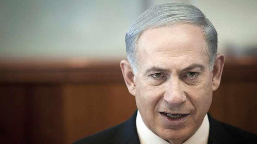 Israel's Prime Minister Benjamin Netanyahu attends the weekly cabinet meeting in Jerusalem November 17, 2013. U.S. Secretary of State John Kerry will travel to Israel on Friday to discuss a proposed deal between world powers and Iran on the Islamic Republic's nuclear programme, Netanyahu said on Sunday. REUTERS/Dan Balilty/Pool (JERUSALEM - Tags: POLITICS HEADSHOT) - RTX15GVA