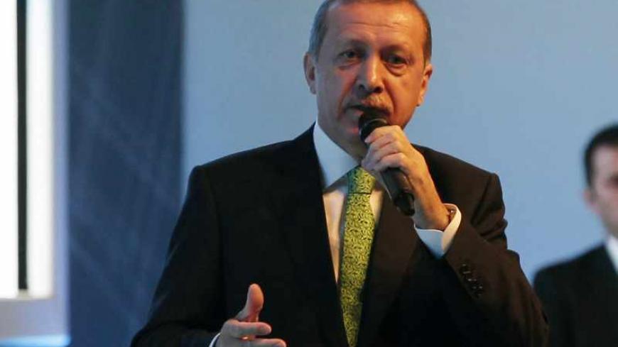 Turkey's Prime Minister Tayyip Erdogan addresses members of his ruling AK Party (AKP) during a meeting in Istanbul December 5, 2013. REUTERS/Osman Orsal (TURKEY - Tags: POLITICS) - RTX164WX