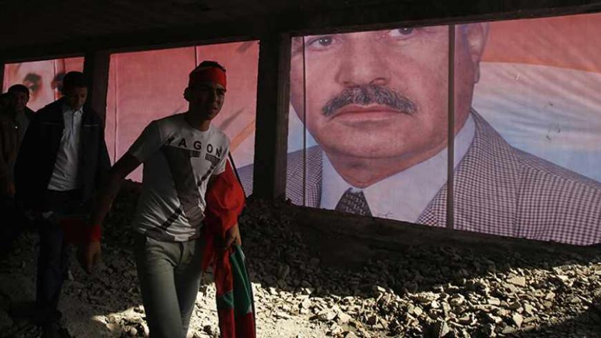 A poster of late leader of the Popular Front for the Liberation of Palestine (PFLP) Abu Ali Mustafa is seen during a rally marking the 46th of the movement founding in Gaza City December 7, 2013. REUTERS/Suhaib Salem (GAZA - Tags: POLITICS CIVIL UNREST ANNIVERSARY) - RTX1682M
