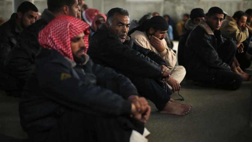 Mourners react at a mosque during the funeral of three-year-old Palestinian girl Hala Bhairi, who medics said was killed by shrapnel from an Israeli strike, in the central Gaza Strip December 25, 2013. A Gaza sniper shot dead an Israeli civilian over the border on Tuesday and Israel hit back with air strikes on two Hamas training camps which hospital officials said killed the Palestinian girl near one of the targets. REUTERS/Suhaib Salem (GAZA - Tags: POLITICS CIVIL UNREST) - RTX16TQV