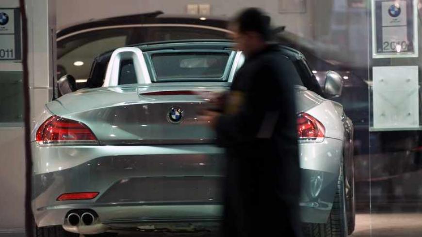 EDITORS' NOTE: Reuters and other foreign media are subject to Iranian restrictions on leaving the office to report, film or take pictures in Tehran.

An Iranian man walks past a BMW displayed at a car shop in central Tehran March 1, 2012. REUTERS/Morteza Nikoubazl (IRAN - Tags: SOCIETY BUSINESS TRANSPORT) - RTR2YP9L