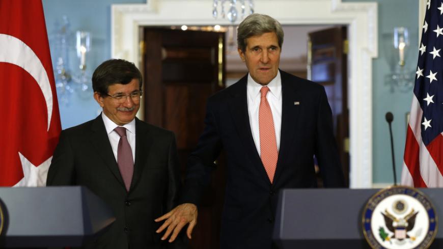 U.S. Secretary of State John Kerry and Turkish Foreign Minister Ahmet Davutoglu (L) arrive to speak to reporters at the State Department in Washington November 18, 2013. 
REUTERS/Kevin Lamarque  (UNITED STATES - Tags: POLITICS) - RTX15J4C