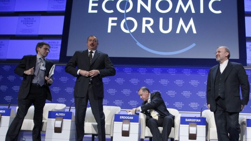 Ian Bremmer, President, Eurasia Group, U.S.A., Azerbaijan's President Ilham Aliyev, Turkey's Prime Minister Tayyip Erdogan and Iran's Foreign Minister Manouchehr Mottaki (L-R) attend a session at the World Economic Forum (WEF) in Davos January 29, 2009. Business leaders and policymakers meeting in Davos turn their attention to financial regulation, energy, trade and global security after hearing China and Russia blame debt-fuelled consumption for massive financial collapse. REUTERS/Pascal Lauener (SWITZER