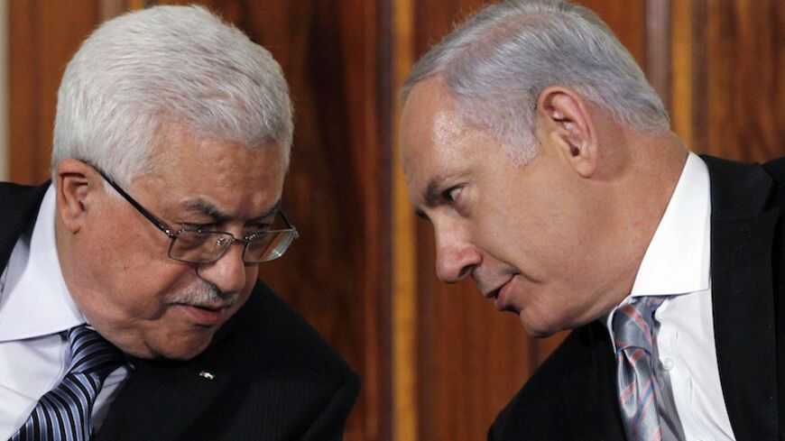 Palestinian President Mahmoud Abbas (L) talks with Israeli Prime Minister Benjamin Netanyahu, as leaders gathered to deliver a joint statement on Middle East Peace talks in the East Room of the White House in Washington September 1, 2010. REUTERS/Jason Reed (UNITED STATES - Tags: POLITICS) - RTR2HTDF