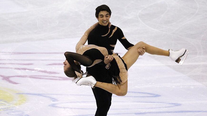 Alisa Agafonova and Alper Ucar of Turkey perform during the pairs ice dance free dance preliminary round at the ISU World Figure Skating Championships in Nice March 26, 2012. REUTERS/Jean-Paul Pelissier (FRANCE  - Tags: SPORT FIGURE SKATING)   - RTR2ZWMI