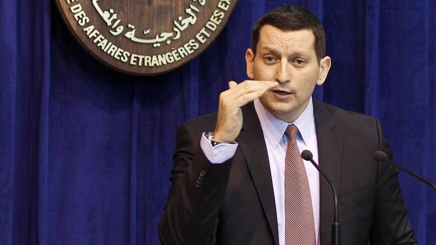 Syrian Foreign Ministry Spokesman Jihad Makdissi speaks during a news conference in Damascus June 25, 2012. Syrian air defences had to react immediately to a Turkish jet flying at 100 metres (330 feet) altitude inside Syrian airspace in what was "a clear breach of Syrian sovereignty", Makdissi said on Monday. REUTERS/Khaled al-Hariri (SYRIA - Tags: POLITICS) - RTR344TP