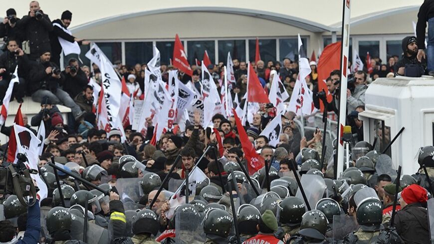 Protesters are blocked by Turkish soldiers as they try to march to a court house near Istanbul December 13, 2012. Thousands of Turkish secularists protested outside a court near Istanbul on Thursday against the trial of nearly 300 people charged with attempting to overthrow Prime Minister Tayyip Erdogan's Islamist-rooted government. Security forces wielded batons and fired pepper spray to keep crowds behind barricades in front of the courthouse at the sprawling Silivri prison complex, where dozens of the de