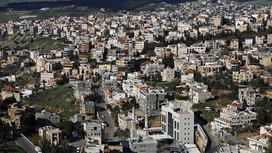 A general view shows the Israeli-Arab city of Umm al-Fahm December 26, 2012. Disillusioned, disappointed and divided, Israeli Arab voters will traipse to the polls next week in ever dwindling numbers, aware that none of their community will have any say in how the country is run. Picture taken December 26, 2012. REUTERS/Ammar Awad (ISRAEL - Tags: POLITICS ELECTIONS) - RTR3CHRA