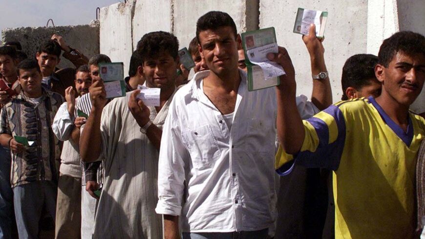 Palestinians displays their I.D cards as they stand in line waiting to get their special safe passage cards in front of the safe passage office at Erez in the Gaza Strip November 2. On Tuesday Israel for the first time gave Palestinians who were previously not allowed to use the safe passage route for the security reasons, the special "safe passage cards" which will enable them to travel in buses between Gaza and West Bank under the guard of Israeli soldiers. aj/ Photo by Ahmed Jadallah.
AJ/AA - RTRS07Y