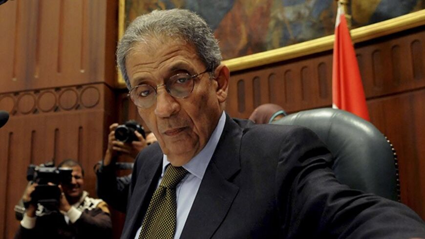Amr Moussa, head of the assembly writing Egypt's new constitution, attends a vote at the Shura Council in Cairo December 1, 2013. The 50-member assembly voted on Sunday against an article requiring parliamentary elections to be held before presidential elections, raising uncertainty about the country's political transition timetable.  REUTERS/Stringer (EGYPT - Tags: POLITICS) - RTX15ZUN