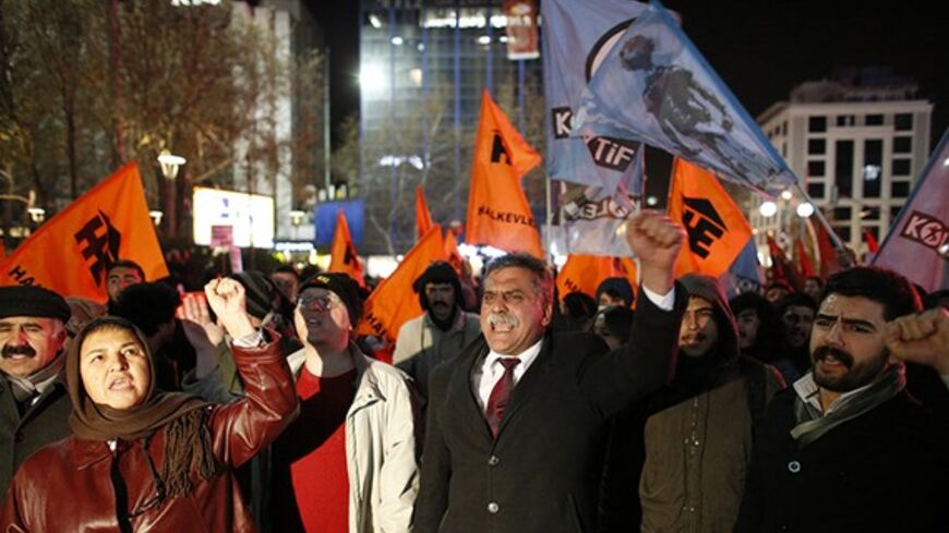 Protesters demonstrate against Turkey's ruling Ak Party (AKP) government and demand that Prime Minister Tayyip Erdogan's resign because of the corruption investigation in Ankara December 18, 2013. Turkish Deputy Prime Minister Bulent Arinc said on Wednesday a corruption investigation in which 52 people including the sons of three cabinet ministers have been detained was part of a "planned operation" to tarnish the government. In the first official comments on the investigation from a senior member of the go