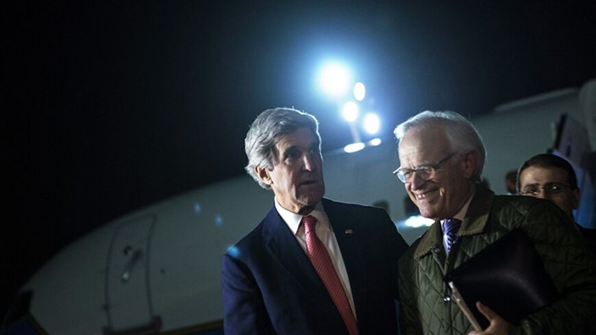 U.S. Secretary of State John Kerry (L) walks with U.S. Special Envoy for Israeli-Palestinian Negotiations Martin Indyk after returning from a day trip to Jordan and Saudi Arabia at Ben Gurion International Airport in Tel Aviv January 5, 2014. REUTERS/Brendan Smialowski/Pool (ISRAEL - Tags: POLITICS) - RTX173CK