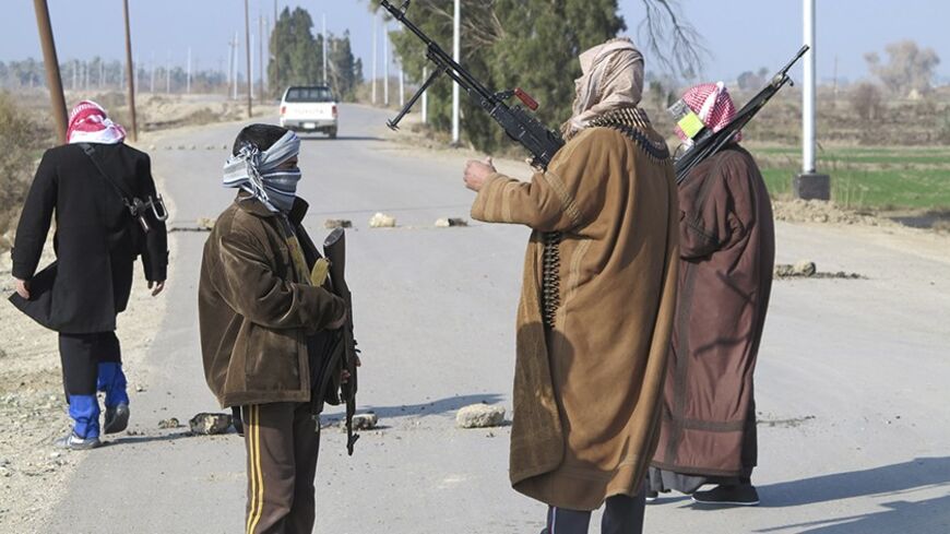 Tribal fighters deploy themselves on the streets of Ramadi January 6, 2014. Iraq's prime minister urged people in the besieged city of Falluja on Monday to drive out al Qaeda-linked insurgents to pre-empt a military offensive that officials said could be launched within days. In a statement on state television, Nuri al-Maliki, a Shi'ite Muslim whose government has little support in Sunni-dominated Falluja, called on tribal leaders to drive out militants who last week seized key towns in the desert leading t