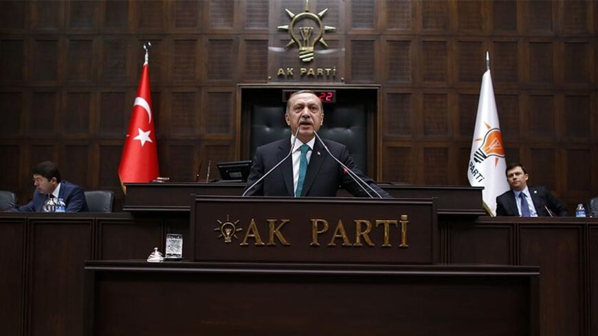 Turkey's Prime Minister Tayyip Erdogan addresses members of parliament from his ruling AK Party (AKP) during a meeting at the parliament in Ankara January 14, 2014. Erdogan looks to have the upper hand in a civil war rocking Turkey's political establishment, but his bid to break the influence of a potent Islamic cleric could roll back reforms and undermine hard-won business confidence. What erupted a month ago as a damaging inquiry into alleged government corruption has spiralled into a battle over the judi