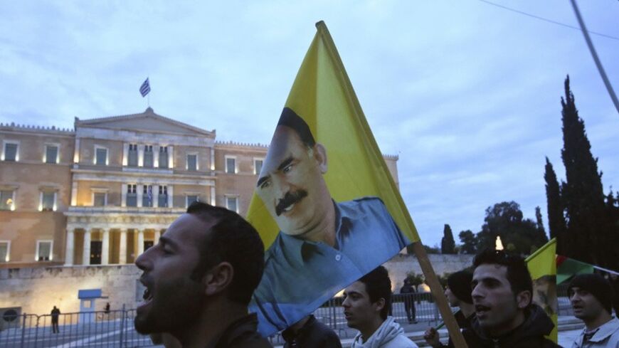 Kurdish protesters shout slogans during a rally in Athens January 18, 2014. A few hundred members of the Kurdish community in Greece marched to the office of the European Commission to request that the situation of Kurds in Syria be discussed at the upcoming Geneva 2 Conference. REUTERS/Giorgos Moutafis (GREECE - Tags: POLITICS SOCIETY IMMIGRATION CIVIL UNREST) - RTX17JVY