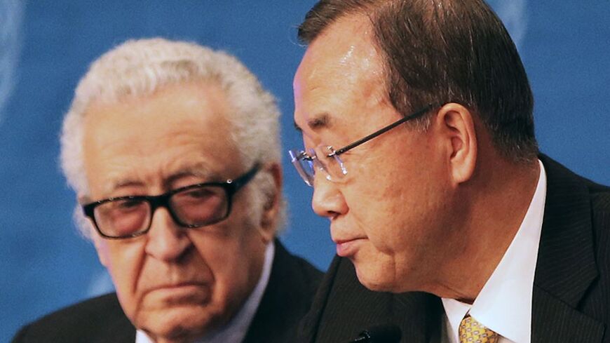 U.N. special envoy for Syria Lakhdar Brahimi speaks to U.N. Secretary-General Ban Ki-moon (R) during a news conference after the Geneva-2 peace talks in Montreux January 22, 2014. An international conference on Syria ended on Wednesday, with Ban calling on both Syrian delegations to work sincerely for a solution to the nearly three-year-old conflict. REUTERS/Jamal Saidi (SWITZERLAND - Tags: POLITICS) - RTX17Q4I