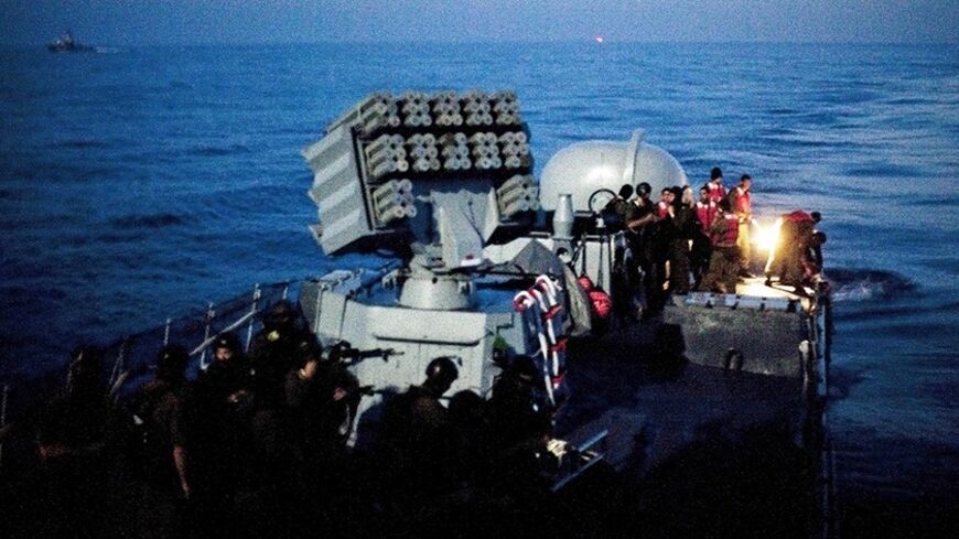 Israeli soldiers ride aboard a naval vessel in the Mediterranean Sea May 31, 2010. Israeli marines stormed a Turkish aid ship bound for Gaza on Monday and 10 pro-Palestinian activists were killed, triggering a diplomatic crisis and plans for an emergency session of the U.N. Security Council. REUTERS/Uriel Sinai/Pool (POLITICS CIVIL UNREST) - RTR2ELNX