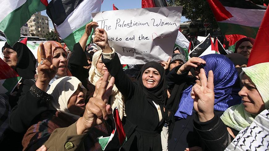 Palestinian women mark International Women's Day with a rally calling for an end to Palestinian divisions, in Gaza City March 8, 2011. Female protesters rallied to voice their frustrations over the unending split between Hamas and Abbas's Fatah movement and the lack of progress towards a peace that will end Israeli occupation and finally give them a state of their own. REUTERS/Mohammed Salem (GAZA - Tags: POLITICS SOCIETY IMAGES OF THE DAY) - RTR2JLMD