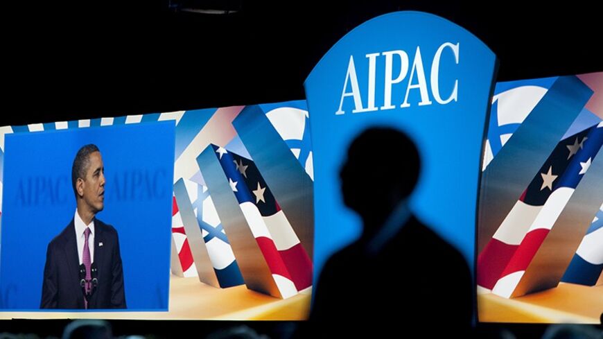 U.S. President Barack Obama is pictured on-screen speaking at the American Israel Public Affairs Committee (AIPAC) policy conference in Washington March 4, 2012. REUTERS/Joshua Roberts (UNITED STATES - Tags: POLITICS) - RTR2YU77