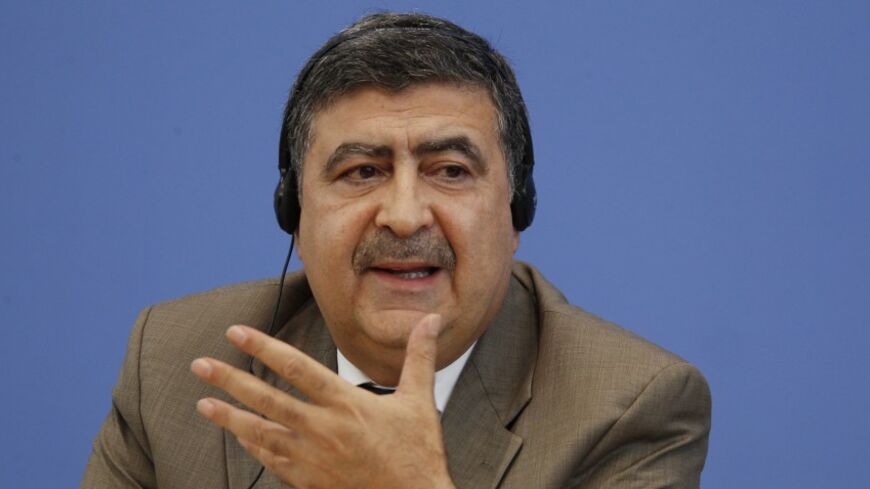Member of the Syrian National Council Murhaf Jouejati speaks during a news conference in Berlin, August 28, 2012. Jouejati and two fellow members of the Syrian opposition presented the results of the project 'The Day After: Supporting a Democratic Transition in Syria'.   REUTERS/Thomas Peter (GERMANY  - Tags: POLITICS) - RTR376QN