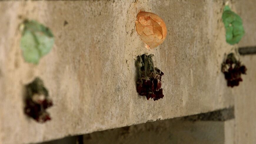 Painted eggs and dried flowers decorate doorway in the Lalish temple
some 50 km north of Mosul, May 11, 2003. The Yezidi religion, seen by
its followers as the original Kurdish faith, is believed to date back
several thousand years and blends ideas from sources as diverse as
Zoroastrianism, Islam and Christianity. REUTERS/Shamil Zhumatov
REUTERS

SZH/AS - RTRNBOT