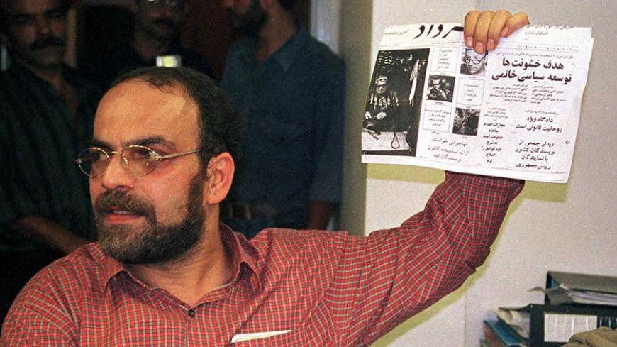 Mashallah Shamsolvaezin, editor of the daily newspaper Neshat which was closed September 4 holds a copy of a fellow reformist newspaper Khordad publishing a headline questioning the Islamic principal of retribution. Iranian authorities forced the outspoken newspaper to close after questioning the principle of Islamic retribution and asking the supreme clerical leader to avoid factional politics.

CJF/WS - RTRQYJJ