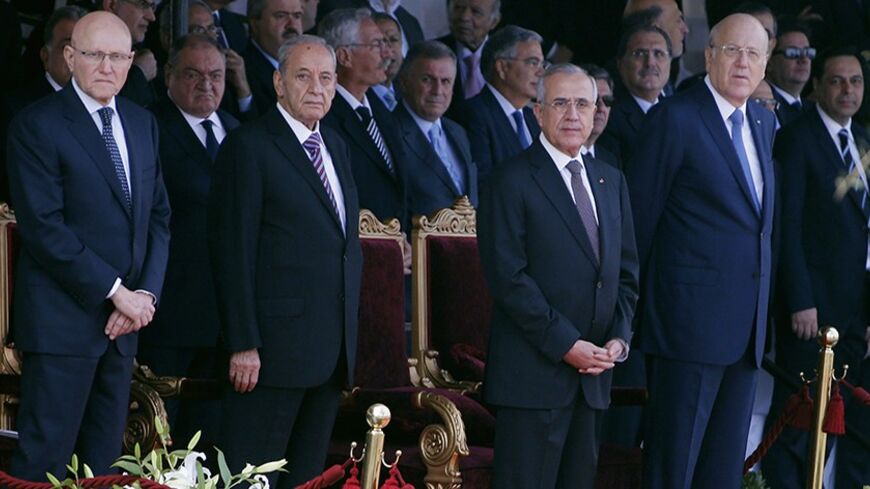 (From L to R) Lebanon's Prime Minister-designate Tammam Salam, parliamentary speaker Nabih Berri, Lebanon's President Michel Suleiman and caretaker Prime Minister Najib Mikati attend a military parade to celebrate the 70th anniversary of Lebanon's independence in downtown Beirut November 22, 2013. REUTERS/Mohamed Azakir (LEBANON - Tags: ANNIVERSARY POLITICS MILITARY) - RTX15OH8