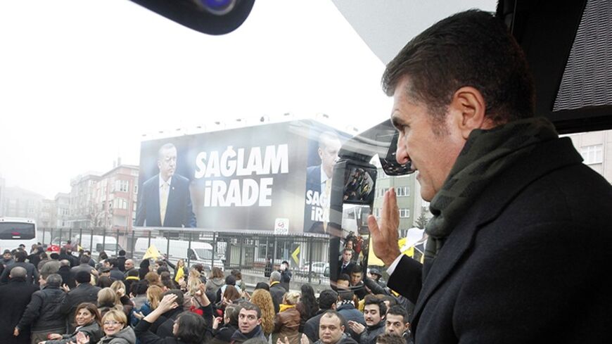 Mustafa Sarigul greets his supporters before a rally in Istanbul January 26, 2014. Two months before elections which could reshape Turkey's political landscape, the main opposition candidate for mayor of its biggest city is taking the fight to a bastion of Prime Minister Tayyip Erdogan's Islamist-rooted AK Party. At stake is much more than just local politics, and Sarigul's secularist Republican People's Party (CHP) is hoping for a breakthrough in places like the conservative district of Fatih in Istanbul's