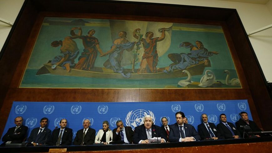 Syria's Foreign Minister Walid al-Moualem (C) addresses a news conference at the United Nations European headquarters in Geneva January 31, 2014. A first round of talks to end the war in Syria have had no tangible results because of the immaturity of the opposition delegation and their "threats to implode" the talks, as well as blatant U.S. interference, al-Moualem said on Friday. REUTERS/Denis Balibouse (SWITZERLAND - Tags: POLITICS CONFLICT CIVIL UNREST) - RTX182CD