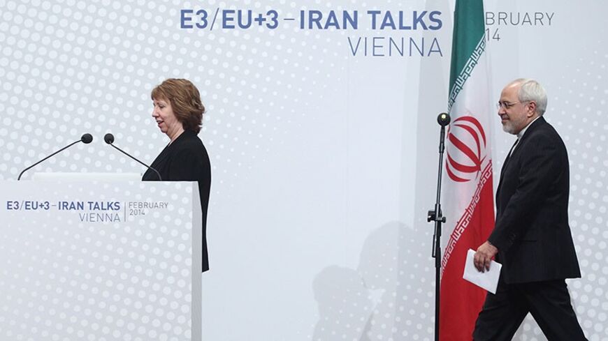 European Union foreign policy chief Catherine Ashton (L) and Iranian Foreign Minister Mohammad Javad Zarif arrive for a press statement after a conference in Vienna February 20, 2014. Iran and six world powers have agreed on an agenda for negotiations over Tehran's nuclear programme and will meet again in the second half of March in Vienna. REUTERS/Heinz-Peter Bader  (AUSTRIA - Tags: POLITICS ENERGY BUSINESS) - RTX195VO