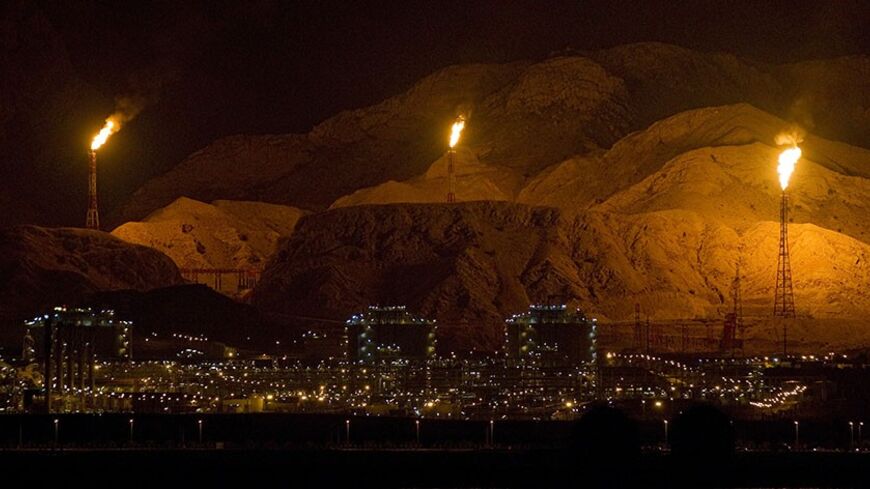 EDITORS' NOTE: Reuters and other foreign media are subject to Iranian restrictions on their ability to film or take pictures in Tehran.
Gas refineries and petrochemical plants are seen in Assalouyeh, 1,000 km (621 miles) south of Tehran, January 26, 2011. Picture taken January 26. REUTERS/Caren Firouz (IRAN - Tags: BUSINESS ENERGY) - RTXX59T