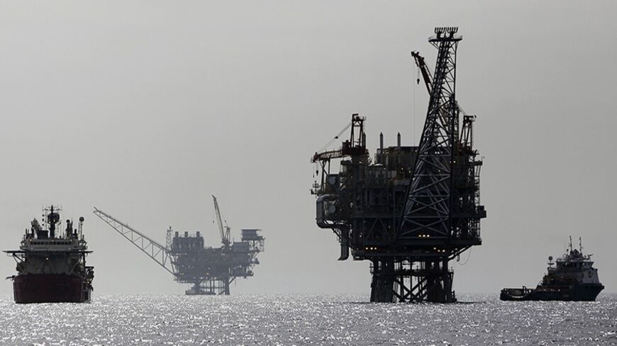 Israeli gas platforms are seen in the Mediterranean sea, some 15 miles (24 km) west of the port city of Ashdod, February 25, 2013. Israel's huge new offshore gas resource offers its enemies an obvious target and gives its navy, long overshadowed by other branches of the Israeli armed forces, a big job that will require extra spending. Picture taken February 25, 2013. REUTERS/Amir Cohen (ISRAEL - Tags: MILITARY ENERGY BUSINESS POLITICS MARITIME) - RTXY5G1