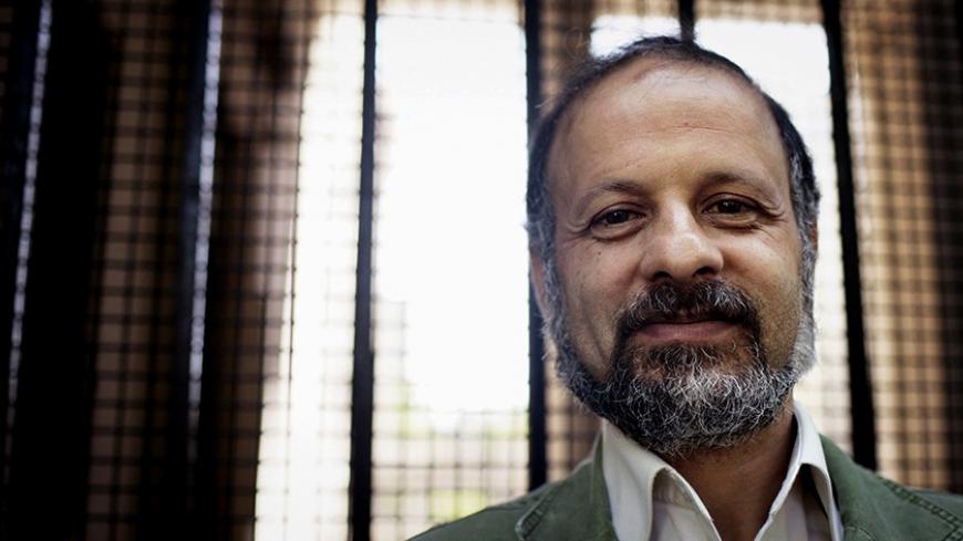 LONDON - JULY 14:  Journalist Akbar Ganji poses for a photograph outside Bush House in on July 14, 2006 in London, England. Mr Akbar has called for a three day hunger strike starting this morning at 10 am GMT in protest against human rights violations in Iran.  (Photo by Bruno Vincent/Getty Images)