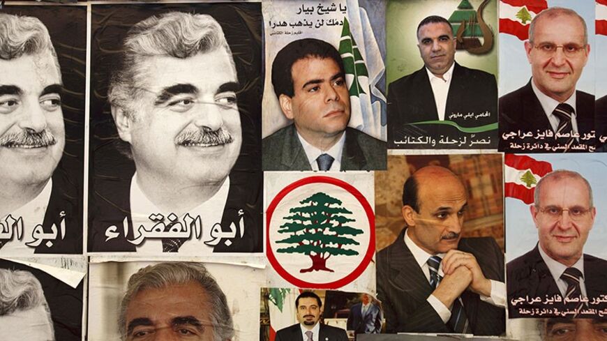 Future Movement campaign posters featuring members of the "March 14" Alliance are displayed on the walls of a tent in the Bekka Valley village of Qabb Elias June 5, 2009. Lebanese vote on June 7 in a parliamentary election that pits the powerful Shi'ite group Hezbollah and its allies against an anti-Syrian alliance that won a 2005 poll. The vote will determine the shape of parliament and government until 2013.     REUTERS/Steve Crisp (LEBANON ELECTIONS POLITICS) - RTR24BIR